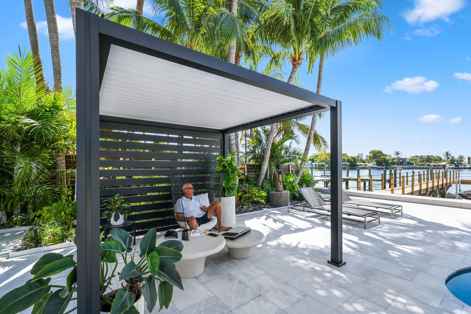 Modern outdoor pergola with Portland Window Coverings in Tigard, OR, overlooking waterfront