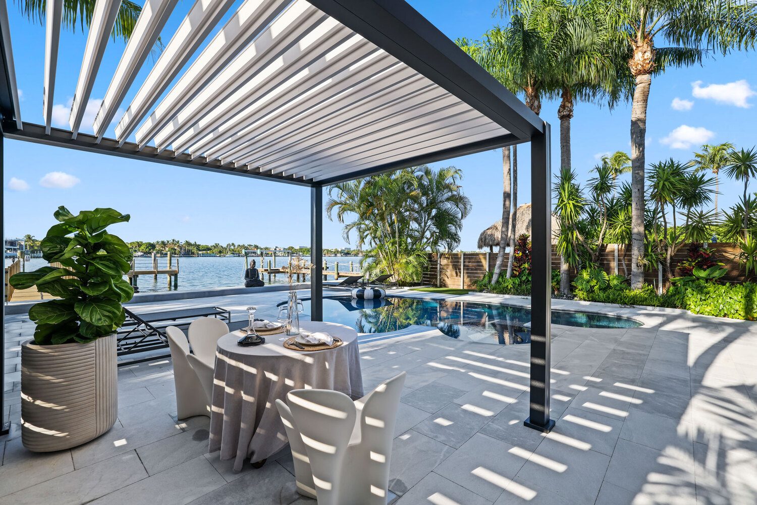 Outdoor patio with stylish pergola and Portland Window Coverings in Tigard, OR