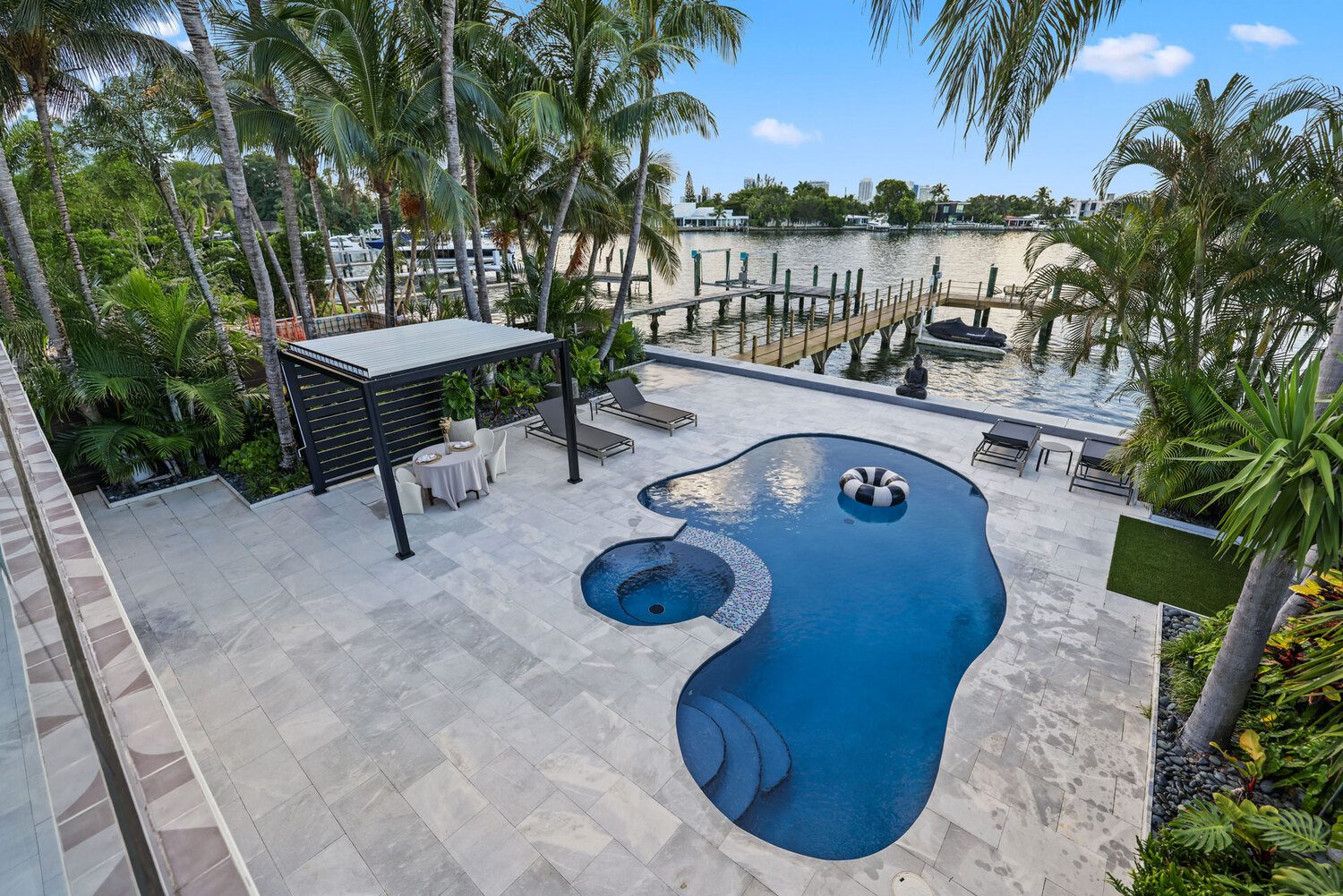 Outdoor pool area with pergola and lounge chairs featuring Portland Window Coverings in Tigard, OR