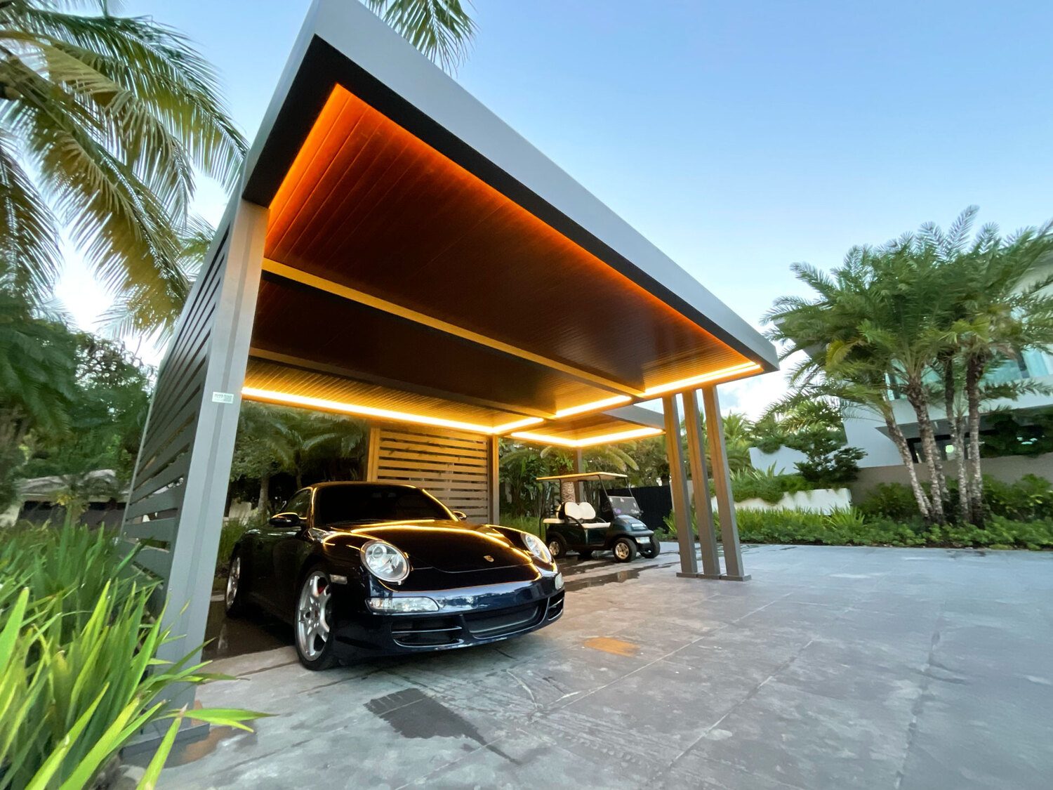 Modern carport with luxury car and Portland Window Coverings lighting in Tigard, OR